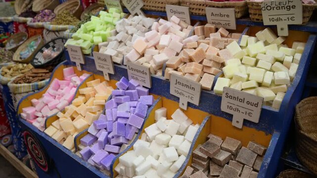 Marrakech, morocco. August 8, 2026. Display of various colorful, fragrant, handmade natural soaps and solid perfumes for sale at a traditional market stall in the medina of marrakech
