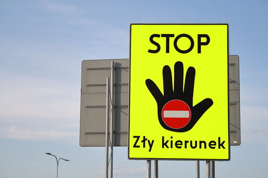 Stop sign with raised hand in polish, indicating wrong way
