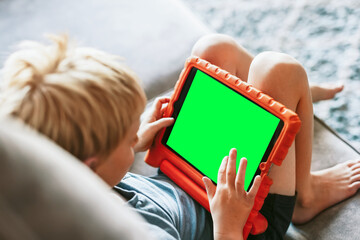 Child using tablet with focus, suitable as mockup