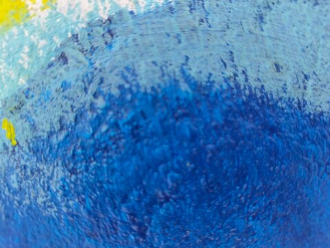 Dreamy blue and turquoise paint gradient with yellow accent, soft abstract texture