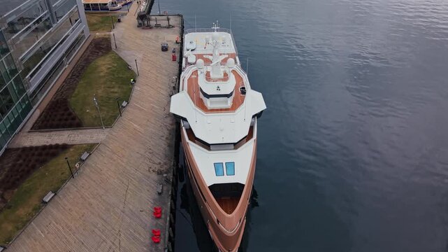 This captivating glimpse reveals La Datcha, a luxurious expedition yacht gracefully resting at the dock in Halifax, Nova Scotia, showcasing its elegant design and serene surroundings