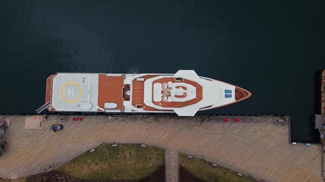 A stunning aerial view reveals the majestic La Datcha, an expedition yacht, resting gracefully at the dock in Halifax. Immerse yourself in the luxury and charm of this city backdrop