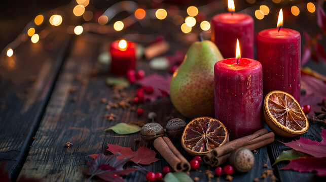 Moody rustic autumn still life with red candles pear and spices on dark wood for Thanksgiving dinner invitation and fragrance editorial