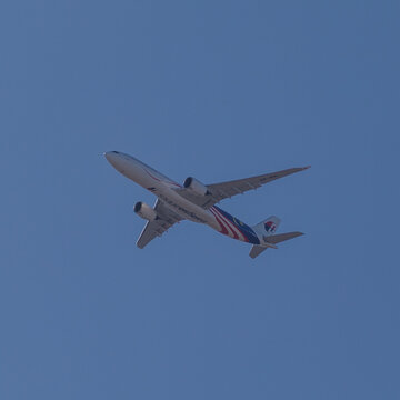 22 August 2026 Malaysia Airline Plane in full flight on a clear blue sky over Burwood in Sydney western Suburb NSW Australia