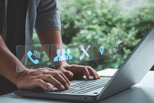 Business professional using a laptop with digital service icons for communication, customer support, repair, location and teamwork, representing modern technology, remote work and connected solutions.