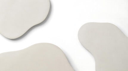 Fototapeta premium Minimalist top view background featuring pastel colored flat organic stone shapes on white surface for contemporary cosmetic branding mockup