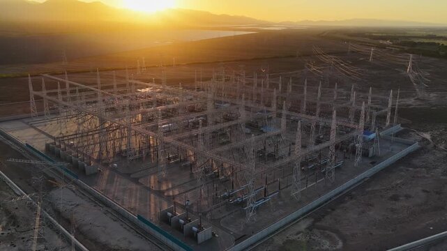 Electrical substation at sunset, high-voltage substation