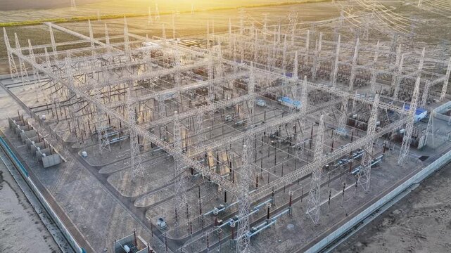 Electrical substation at sunset, high-voltage substation