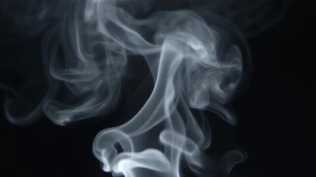 Thin white smoke rises naturally and gently disperses against a dark background. Useful for cinematic overlays, creative advertising, presentations, websites, and visual effects