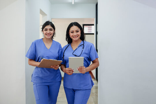 couple of latina women doctors or nurses portrait in a Mexican Hospital in Mexico Latin America. Hispanic healthcare female workers