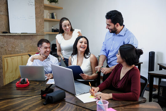 Latin business teamwork with diverse men and women working at office in Mexico Latin America. Portrait of hispanic big group of people employees in a company or workplace