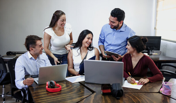 Latin business teamwork with diverse men and women working at office in Mexico Latin America. Portrait of hispanic big group of people employees in a company or workplace