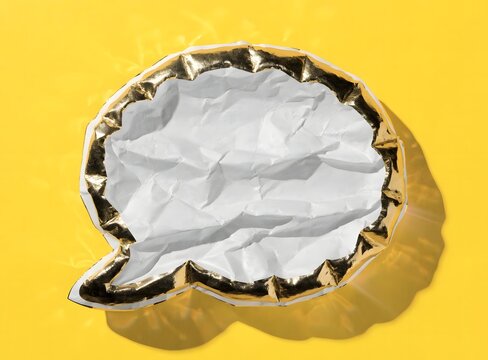 Crushed paper speech bubble golden border yellow background.