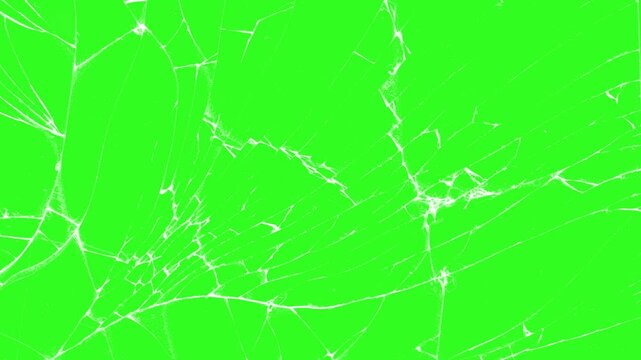 Glass breaking into pieces. Realistic Glass impact crack, glass broken splash, with chroma key green screen as background, Shattered and broken glass shards cracked screen effect 