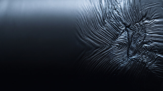 Lithium dendrite branching pattern in battery failure, silver metallic crystalline growth structure on dark blue background, energy storage degradation visualization with copy space