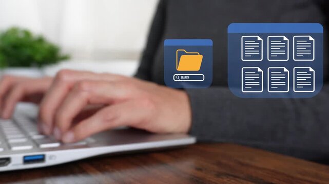 Close-up of a woman working on a computer while pointing at an animation of a digital document management interface