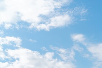 Fototapeta premium the sky is clear blue with fluffy white clouds, the sky is very bright, and the sun shines.