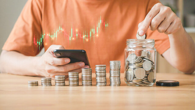 Man saving money in a glass jar, using a smartphone for financial tracking and investment growth
