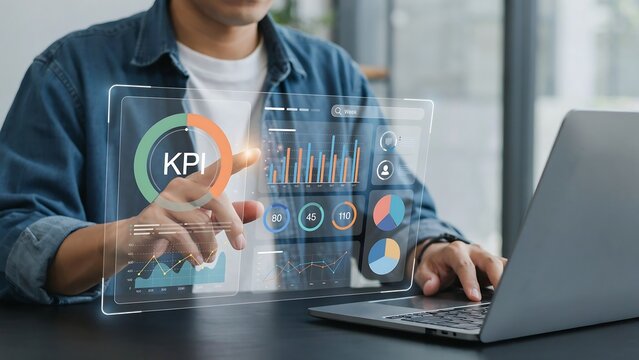 Business analyst interacting with financial key performance indicator dashboard on futuristic transparent screen