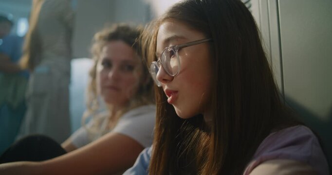Teacher Sit beside Discouraged Teenage Girl, Offering Calm Guidance and Emotional Reassurance before School Day Continues. Mentorship, Student Care, Psychological Safety, and Positive School Culture.
