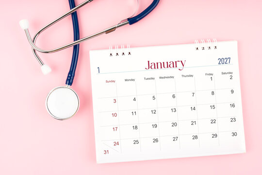Blank January 2027 desk calendar and stethoscope, Medical appointment schedule to check up.