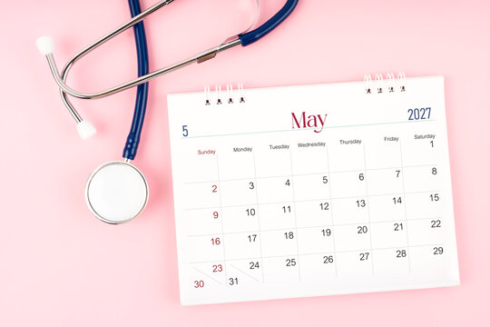 Blank May 2027 desk calendar and stethoscope, Medical appointment schedule to check up.
