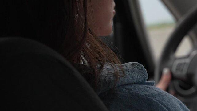 Young Woman Driving Road Trip Adventure On Highway Vertical video.
