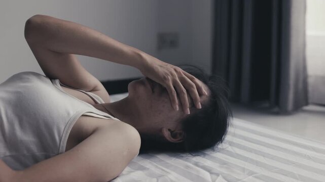 Woman suffering from depression and emotional distress, representing sadness, fear, trauma and the need for safety, care and support.