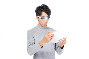 Young man using a tablet with futuristic visor glasses © LaDieuNgoc