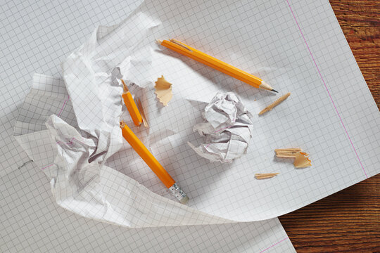 Broken Yellow Pencil and Paper
