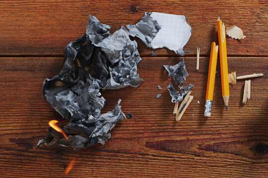 Burning paper and broken pencils