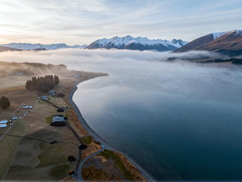 Aerial Drifting Morning Mist Across Lake Tekapo Basin Winter NZ