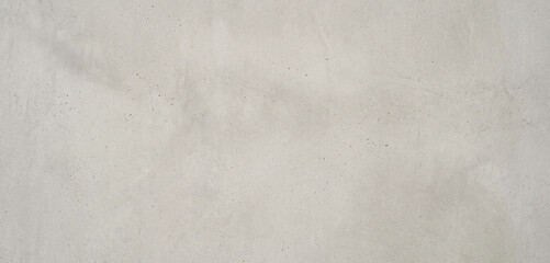 Naklejka premium A smooth, light gray surface of concrete displaying a subtle texture, ideal for backgrounds or architectural designs in various projects.