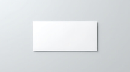 Fototapeta premium Blank White Business Card on a Neutral Gray Background with Subtle Shadow