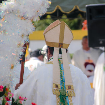Catholic Bishop Participating in Outdoor Religious Celebration