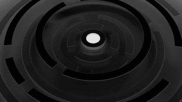 Abstract maze pattern rotating with a luminous core on dark surface