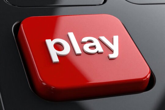Red play button with white 3D text sits on dark keyboard. This simple interactive element signifies starting content, games, or actions. Ideal for media interfaces and digital platforms.