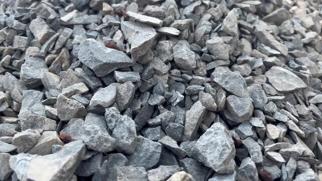 Crushed stones and gravel pile at active construction site