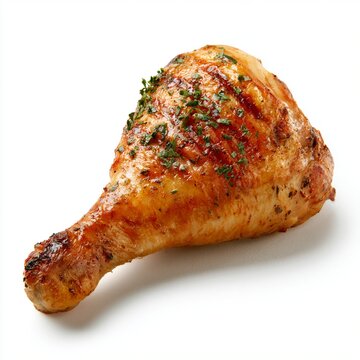 Crispy golden chicken thigh with fresh herbs isolated on pure white background