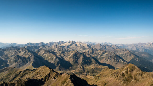 Panoramic view of numerous mountain peaks of the Pyrenees mountains viewed from the 2877 metre high Pic du Midi observatory in France