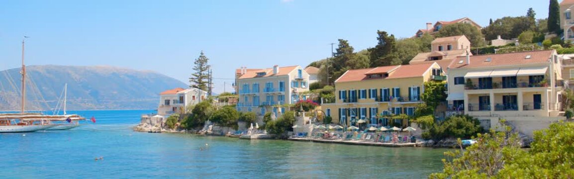 Cinematic View of Fiskardo Harbor in Kefalonia, Greece
