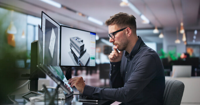 Young Architect Studying 3D Building Model