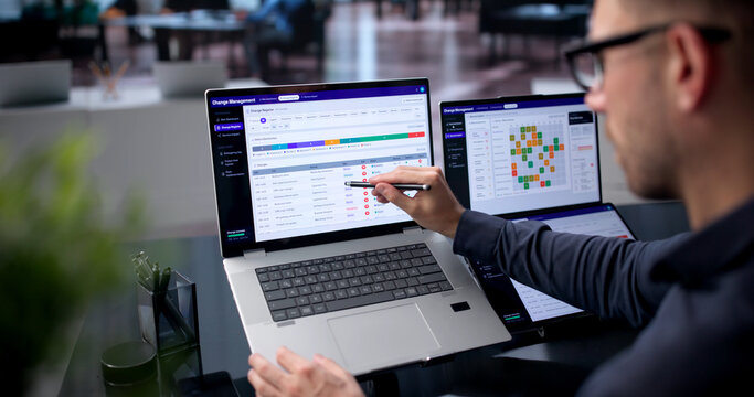 Young IT Manager Reviews Risk Scores