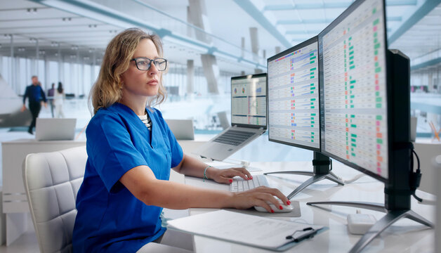 Woman Reviews Medical Billing Codes On Laptop