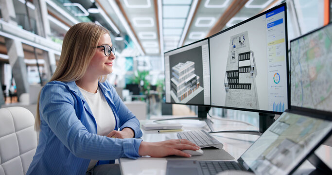 Young Woman Studies Detailed Digital Building Plan