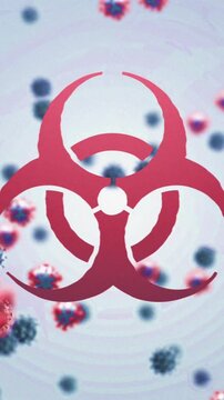 Animation of biohazard sign and covid 19 cells floating over purple background