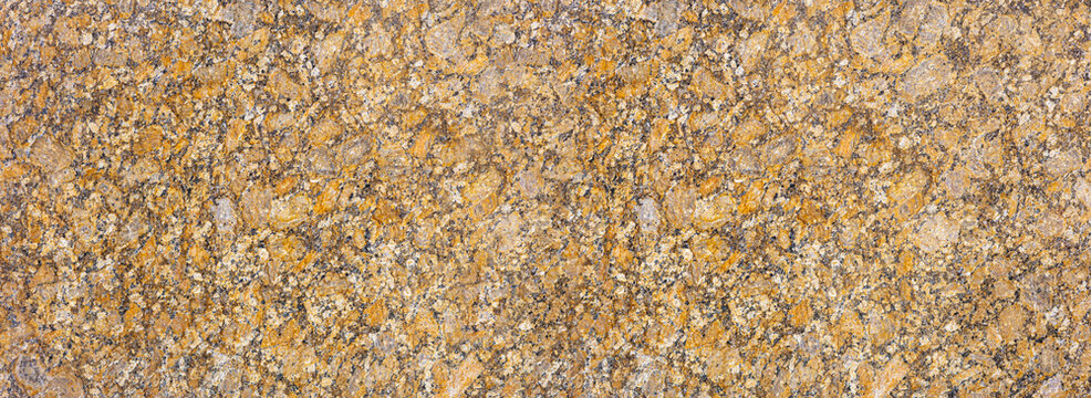 Golden brown granite stone surface texture background