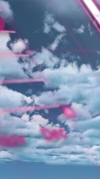 Animation of red charts and data processing over cloudy blue sky
