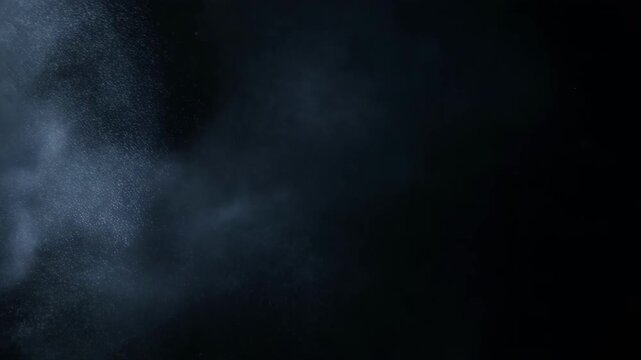 Dark underwater scene with bubbles and particles suspended in water