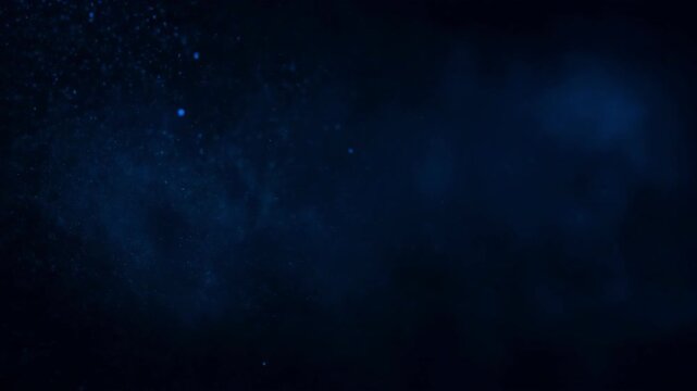 Dark blue background with scattered glowing particles resembling cosmic dust